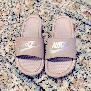 Purple Nike slides